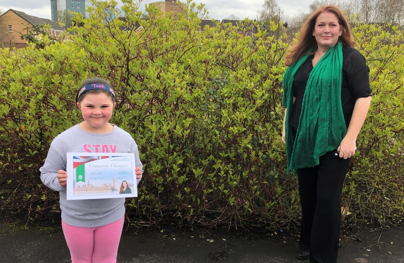 Jane presenting the certificate to Faith