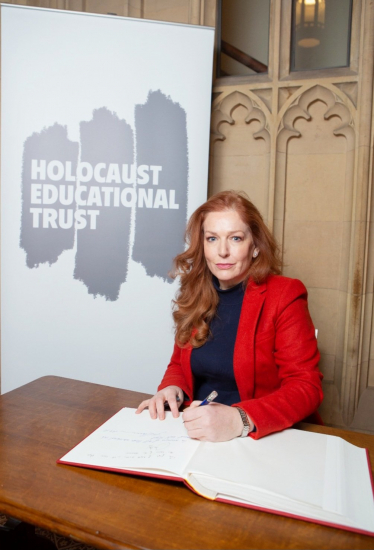 Jane Signs Holocaust Book of Commitment 