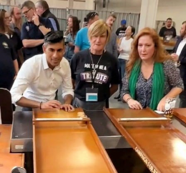 Jane vs Rishi at Shuffleboard